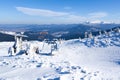 Empty ski lift covered with frost and snow with mountains at background Royalty Free Stock Photo