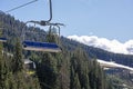 empty ski lift over ancient spruce trees. Royalty Free Stock Photo