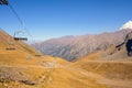 Empty ski-lift in summer in mountains. Royalty Free Stock Photo