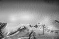 Empty ski lift in winter ski resort - Holidays. Winter landscape of mountain covered of snow in black and white. Glaciers 3000, Royalty Free Stock Photo