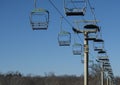 Empty skylift against blue sky Royalty Free Stock Photo