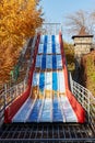 an empty slide in the autumn park