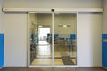Empty sliding glass front door at the airport. Glass doors in the office. Glass entrance. Entrance to administration Royalty Free Stock Photo