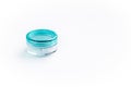 Empty small plastic or glass jar for beauty cream on white background. Acrylic container for skin care cosmetics. Royalty Free Stock Photo