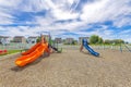 Empty small playground with slides and swings near the houses at Utah Valley Royalty Free Stock Photo