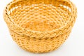 empty small straw basket on white