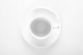 Empty small white porcelain coffee Cup on a white saucer top view isolated on a white background Royalty Free Stock Photo