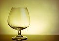 Empty snifter of brandy in elegant typical cognac glass on table Royalty Free Stock Photo