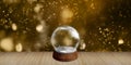 Empty Snow Ball on Wood Background Bokeh Backdrops for New Years Eve Celebrations, Birthdays, Christmas, and Year-end Winter Royalty Free Stock Photo