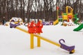 Empty snow children playground in the park in winter time Royalty Free Stock Photo