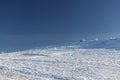 Empty snow-covered slope in the mountains for free skiing against the blue sky. Frosty winter Royalty Free Stock Photo