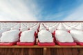 Empty snow-covered stands of the stadium in the winter