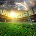 Empty soccer stadium in sunlight