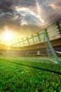 Empty soccer stadium in sunlight