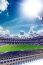 Empty soccer stadium in sunlight