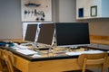 Empty software developer office workplace with a desk with multiple computer screen
