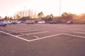 Empty space of car parking lot at public park with sunlight in the morning.