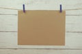 Empty space copy paper hang with wooden clip and rope on wooden boards background Royalty Free Stock Photo
