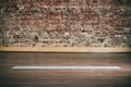 Empty space in fitness center, brick wall, natural wooden floor, modern loft studio, unrolled yoga mat on the floor. Royalty Free Stock Photo