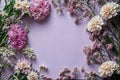 The empty space in the middle of an elegant floral frame made from delicate pastel pink and white flowers. Generative AI.