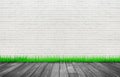 Empty space room of White brick wall and wooden floor with green grass. Royalty Free Stock Photo