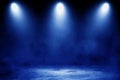 Studio dark room with blue lighting effect and fog on concrete floor in black background. Royalty Free Stock Photo