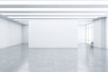 Empty spacious light exhibition or gallery hall with front view on blank white wall, glossy concrete floor, white ceiling and Royalty Free Stock Photo