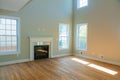 Empty spacious living room with fireplace new apartment