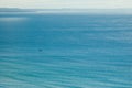 Empty sparkling blue sea with small boat Royalty Free Stock Photo