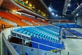 Empty sport hall with rows of armchairs