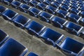 Empty sport stadium plastic chairs in a row