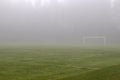 Empty sports field in fog
