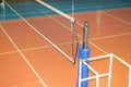 Empty sports hall with a stretched volleyball net and a tower for the judge Royalty Free Stock Photo