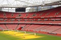 Empty sports stadium with red seats