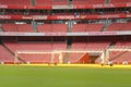 Empty sports stadium with red seats