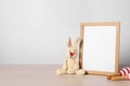 Empty square frame and different toys on white table, space for text Royalty Free Stock Photo
