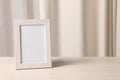 Empty square frame on white wooden table indoors, space for text Royalty Free Stock Photo