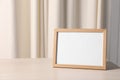 Empty square frame on white wooden table indoors, space for text Royalty Free Stock Photo