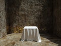 Empty square table with white tablecloth in a dark room Royalty Free Stock Photo