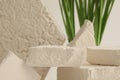 Empty stack of gypsum stones platform podium on beige background. Minimal empty display product presentation scene