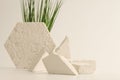 Empty stack of gypsum stones platform podium and grass on beige background. Minimal empty display product presentation scene
