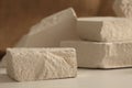Empty stack of stones platform podium on canvas background. Minimal empty display product presentation scene