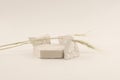 Empty stack of stones platform podium on light beige background. Minimal empty display product presentation scene