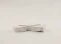 Empty stack of stones platform podium on light beige background. Minimal empty display product presentation scene