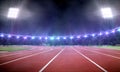 Empty stadium with running track at night Royalty Free Stock Photo