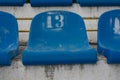 Empty stadium seats with number 13 . Baker`s dozen concept . sports superstitions