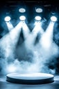 On an empty stage, bright spotlights beam down, cutting through the darkness with their powerful light Royalty Free Stock Photo