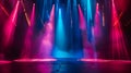 An empty stage is dramatically lit with vibrant blue and purple spotlights Royalty Free Stock Photo