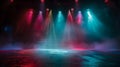 An empty stage is dramatically lit with vibrant blue and purple spotlights Royalty Free Stock Photo