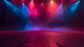An empty stage is dramatically lit with vibrant blue and purple spotlights Royalty Free Stock Photo